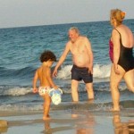 Kiko, frolicking at the beach with friends